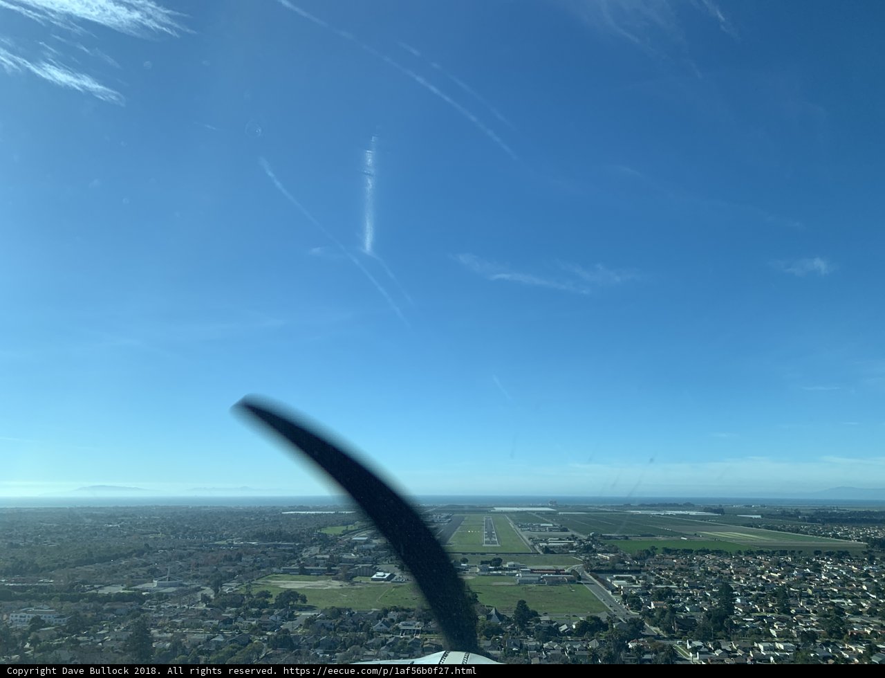 Aerial View of a Cityscape and Runway