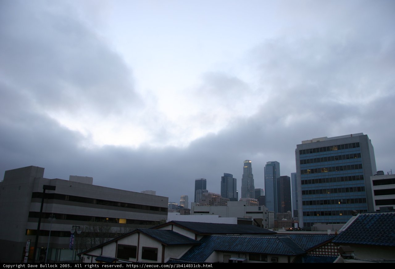 Urban Skyscrapers under a Cloudy Metropolis Sky