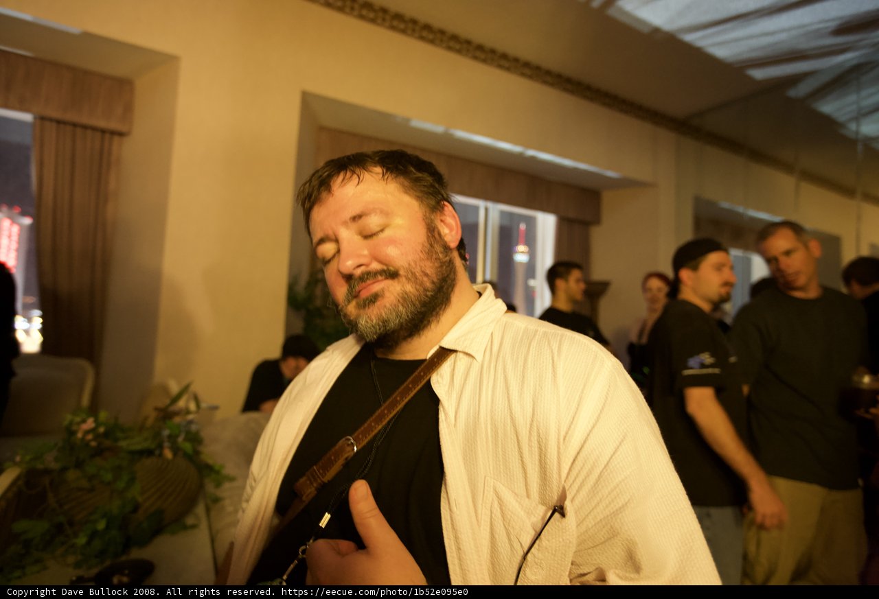Bearded Man Smiling Amongst Flower Arrangement