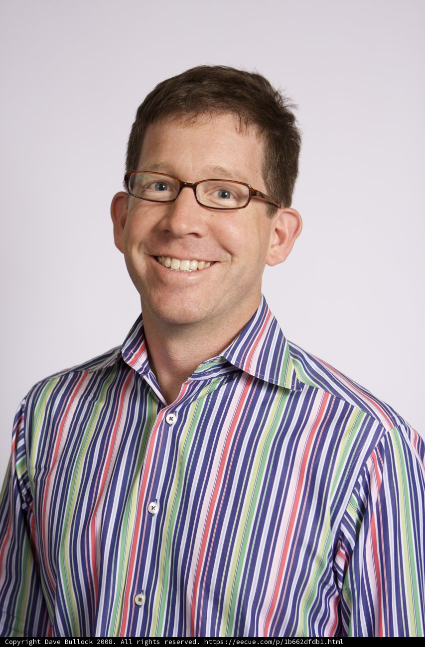 Portrait of a Happy Man in Striped Shirt
