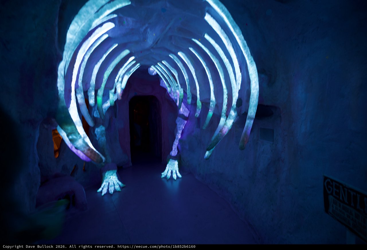 Illuminated Ice Tunnel with Glowing Blue Arches