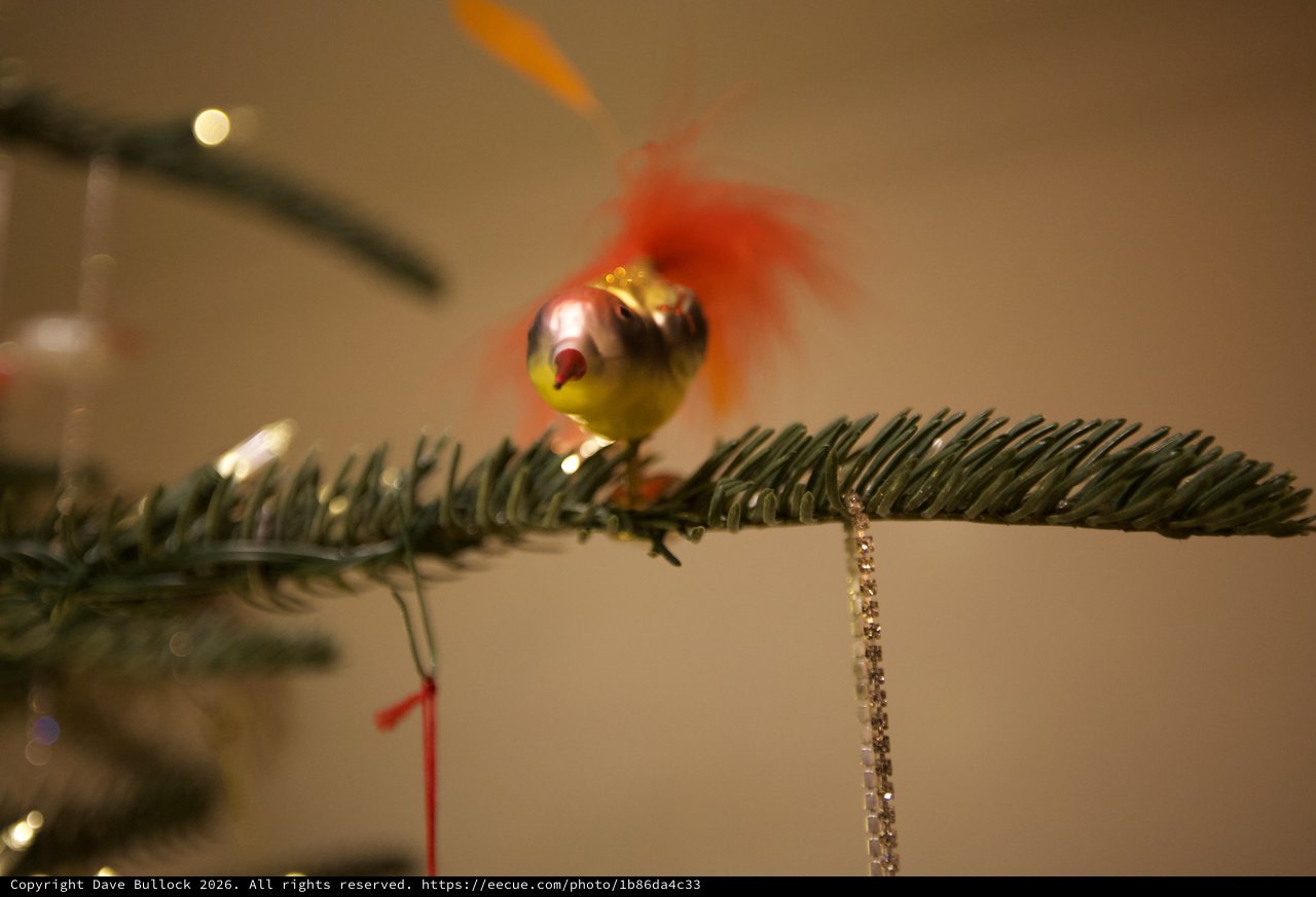 Vintage Glass Bird Ornament on Evergreen Branch