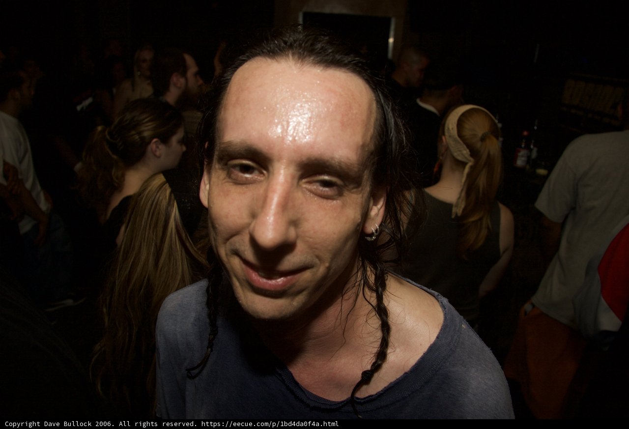 Dreadlocked Man Vibing with the Crowd
