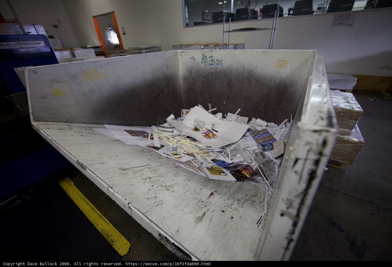 Metal Bin Filled with Plywood and Garbage