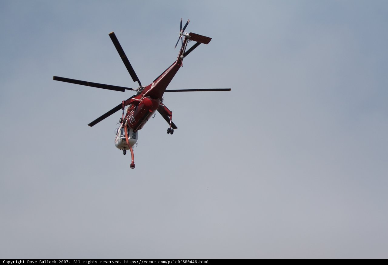 Red Helicopter in Flight