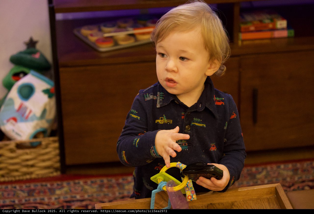 Toddler Playing with Toys on Christmas Eve