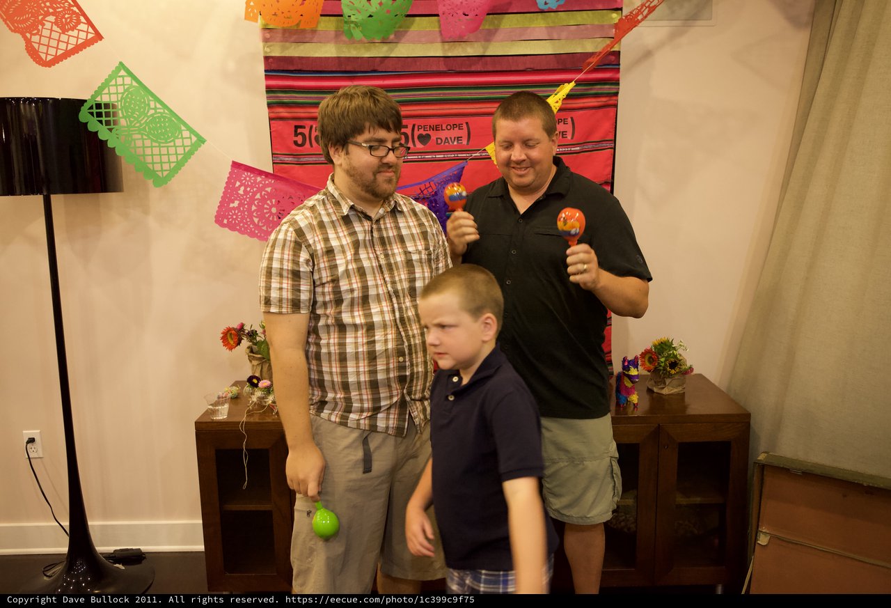 Friends Shake Maracas at Mexican Fiesta Anniversary Party