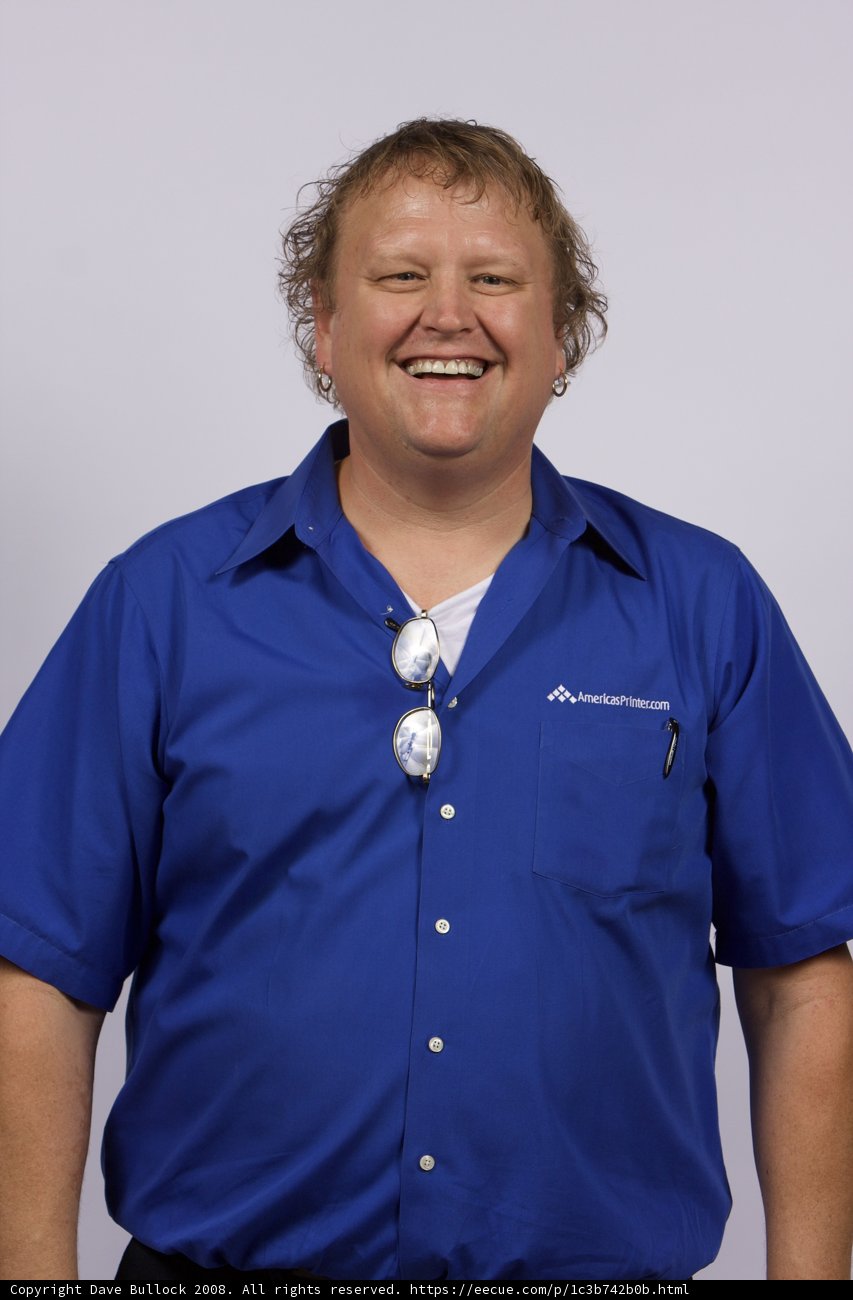 The Smiling Man in a Blue Dress Shirt
