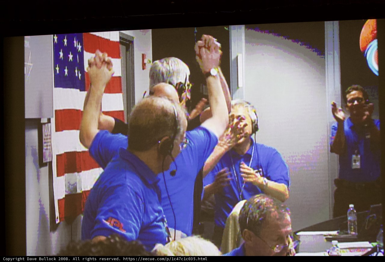 Blue-clad Group Proudly Waves American Flag