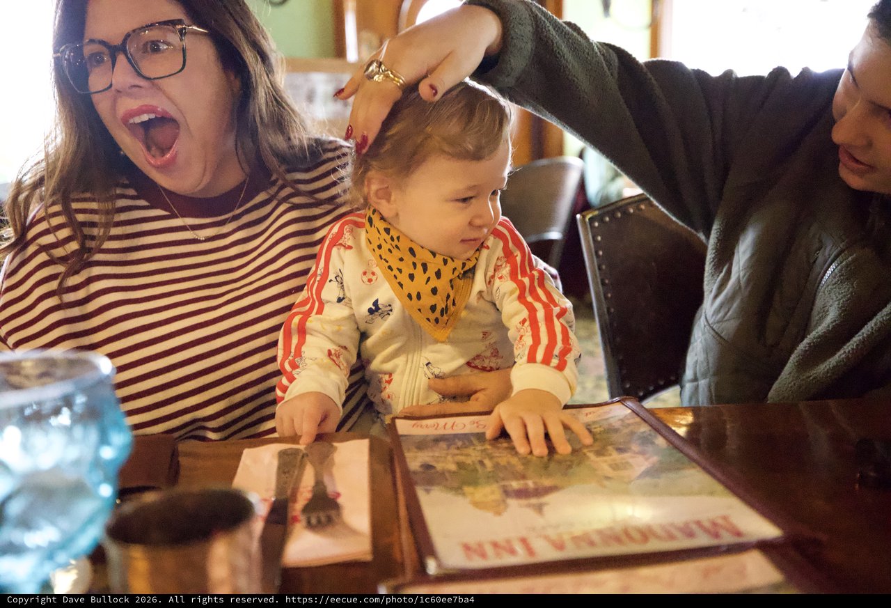 Joyful Family Moment During Child's First Haircut
