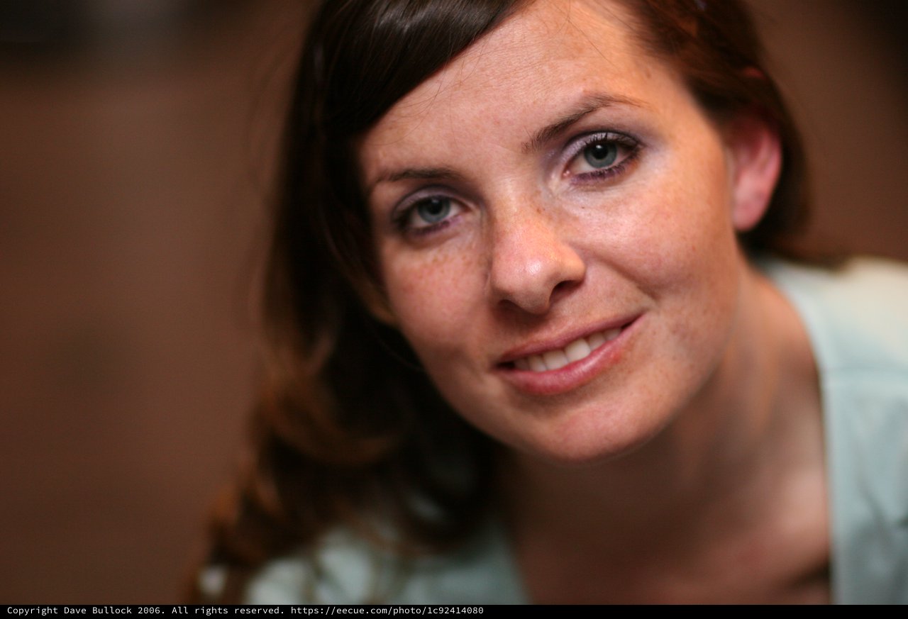 Freckled Smile: Intimate Portrait of a Young Woman