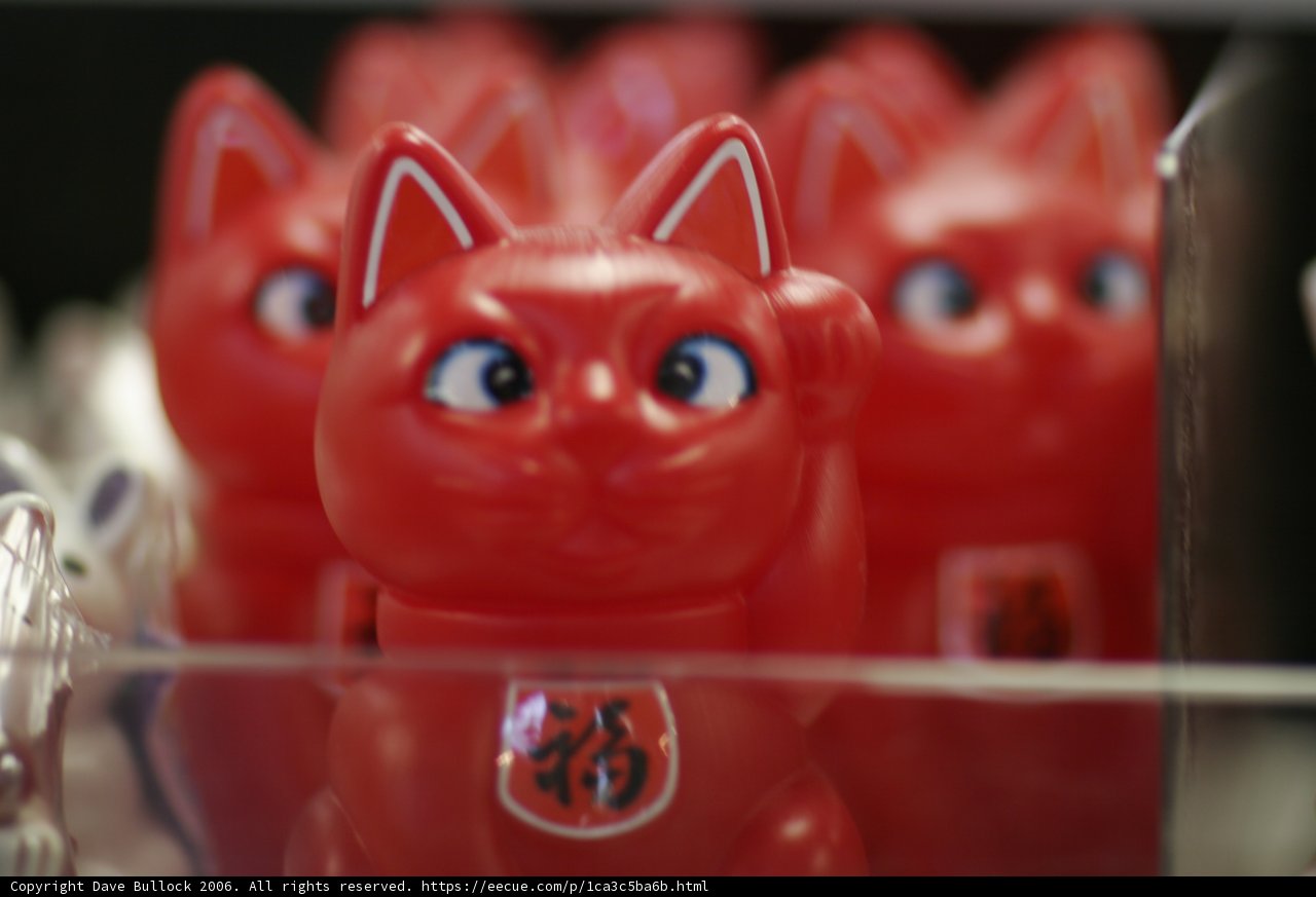 Red Cat Figurine with Mysterious Blue Eye