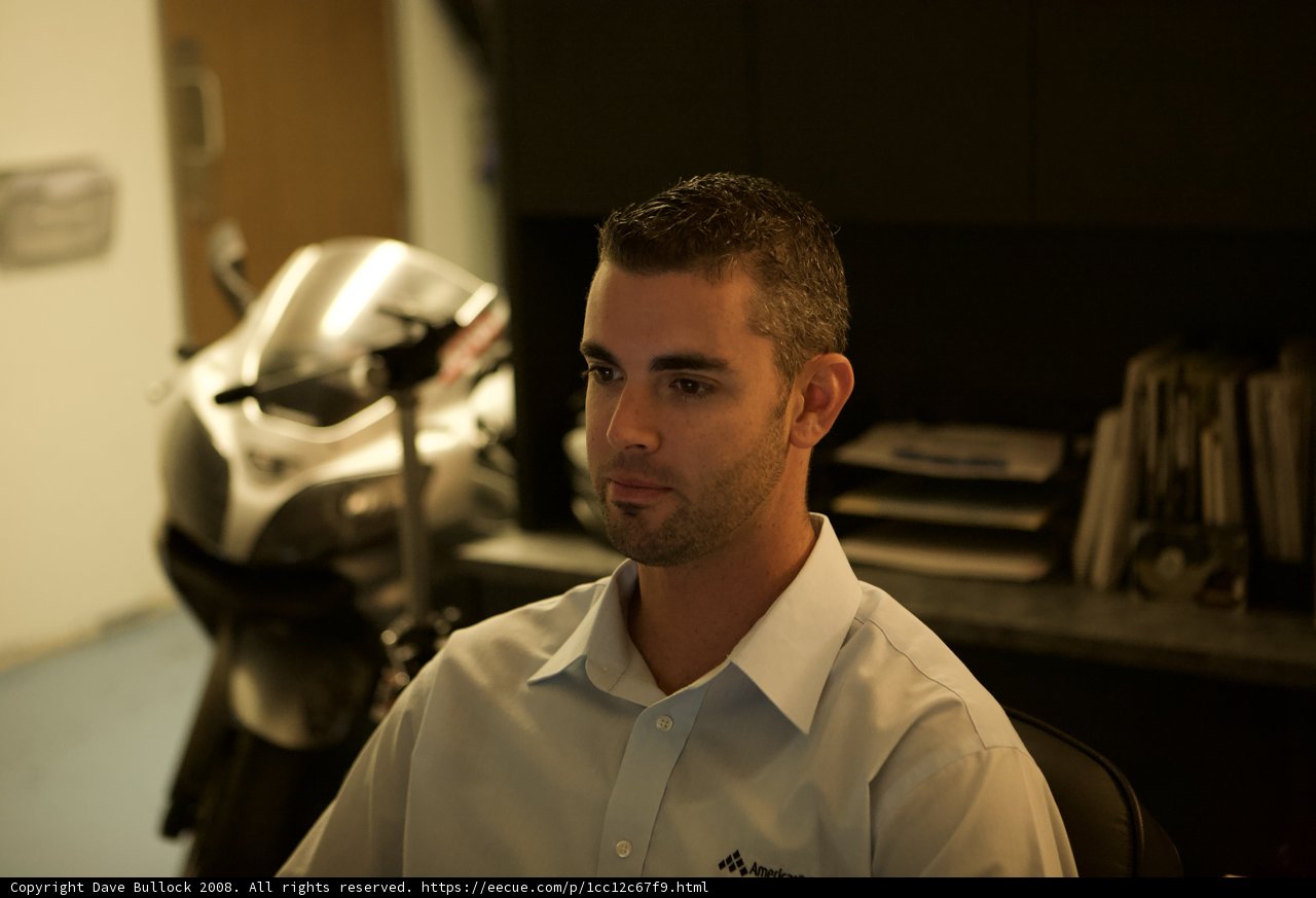 White Shirted Dan B Poses with Motorcycle