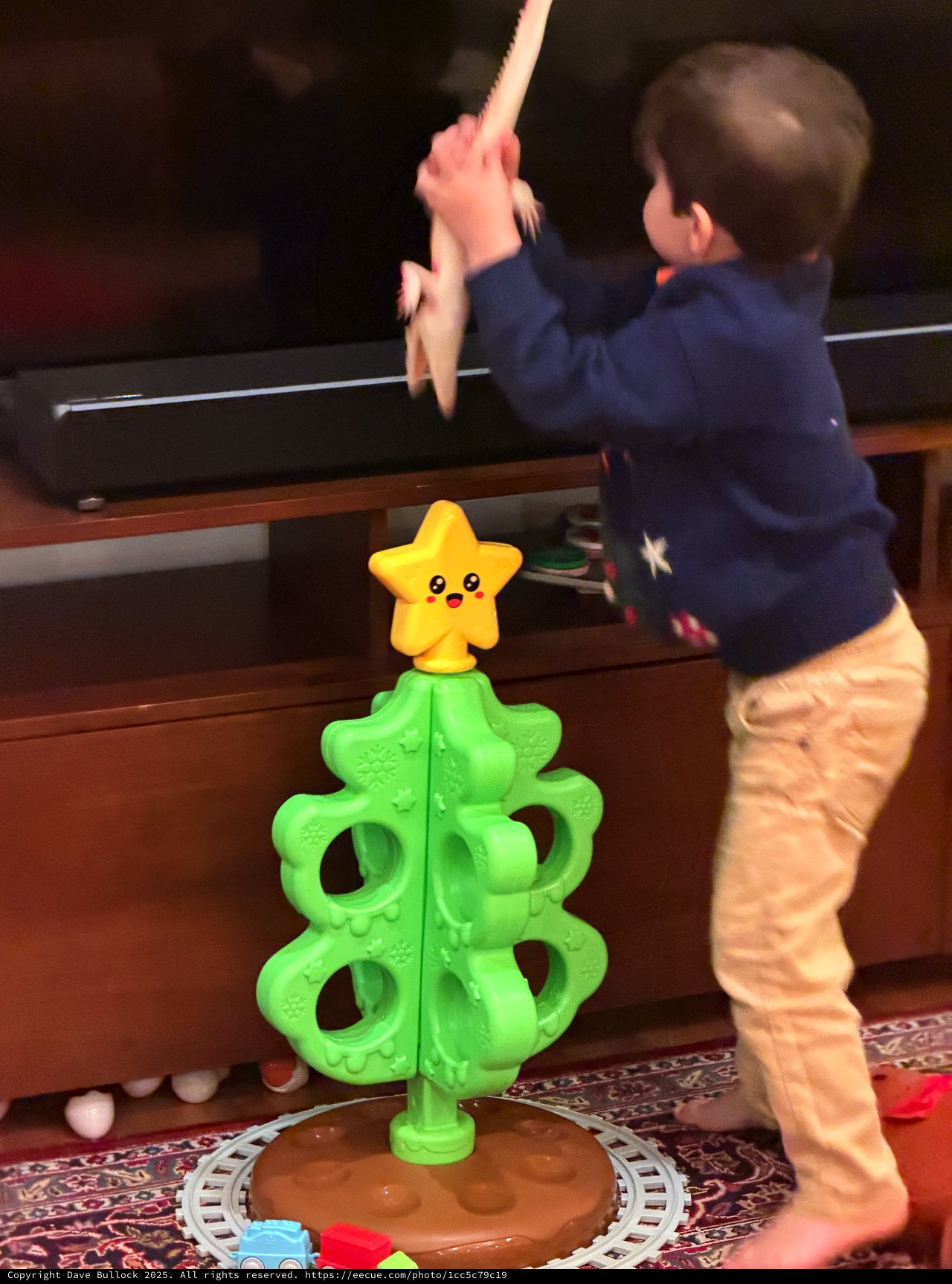 Toddler Playing Interactive Christmas Tree Game at Home