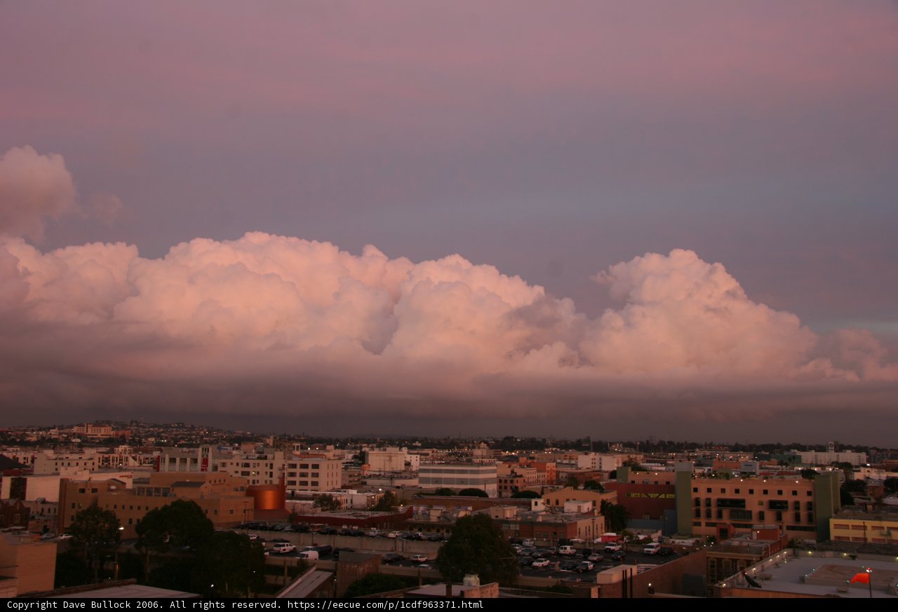 Pink Cumulus Cloud over Urban Landscape