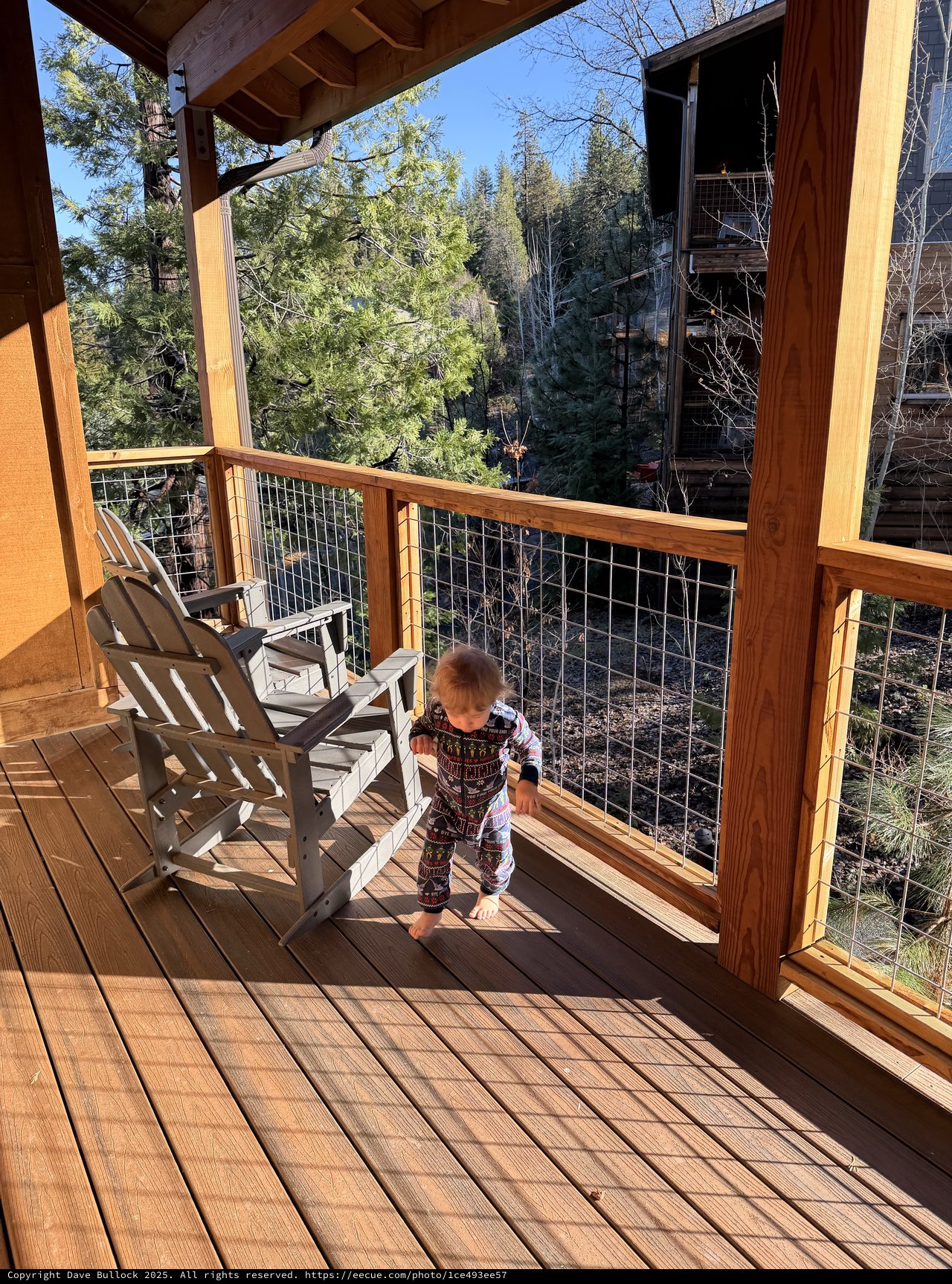 Toddler Explores Cabin Deck at Yosemite