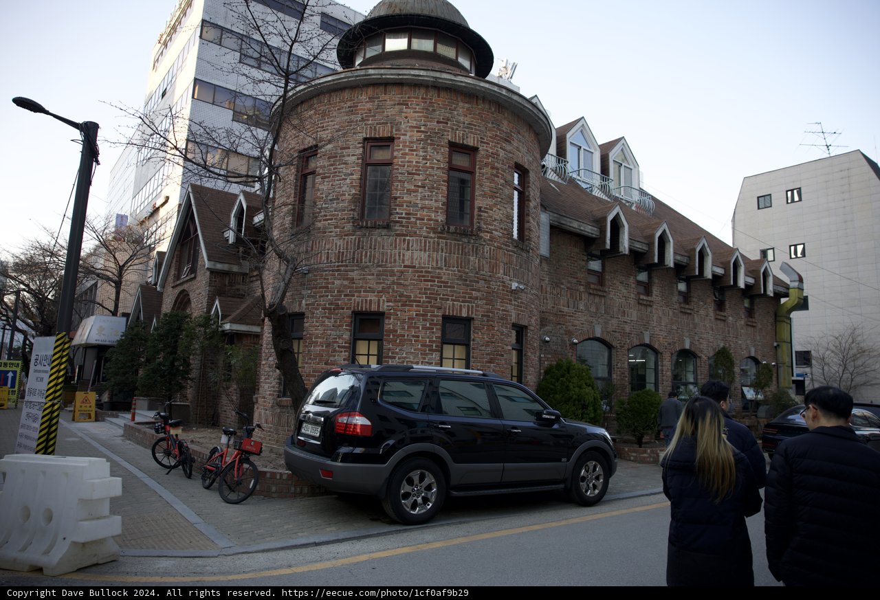 Clock Tower Amidst The Urban Hustle