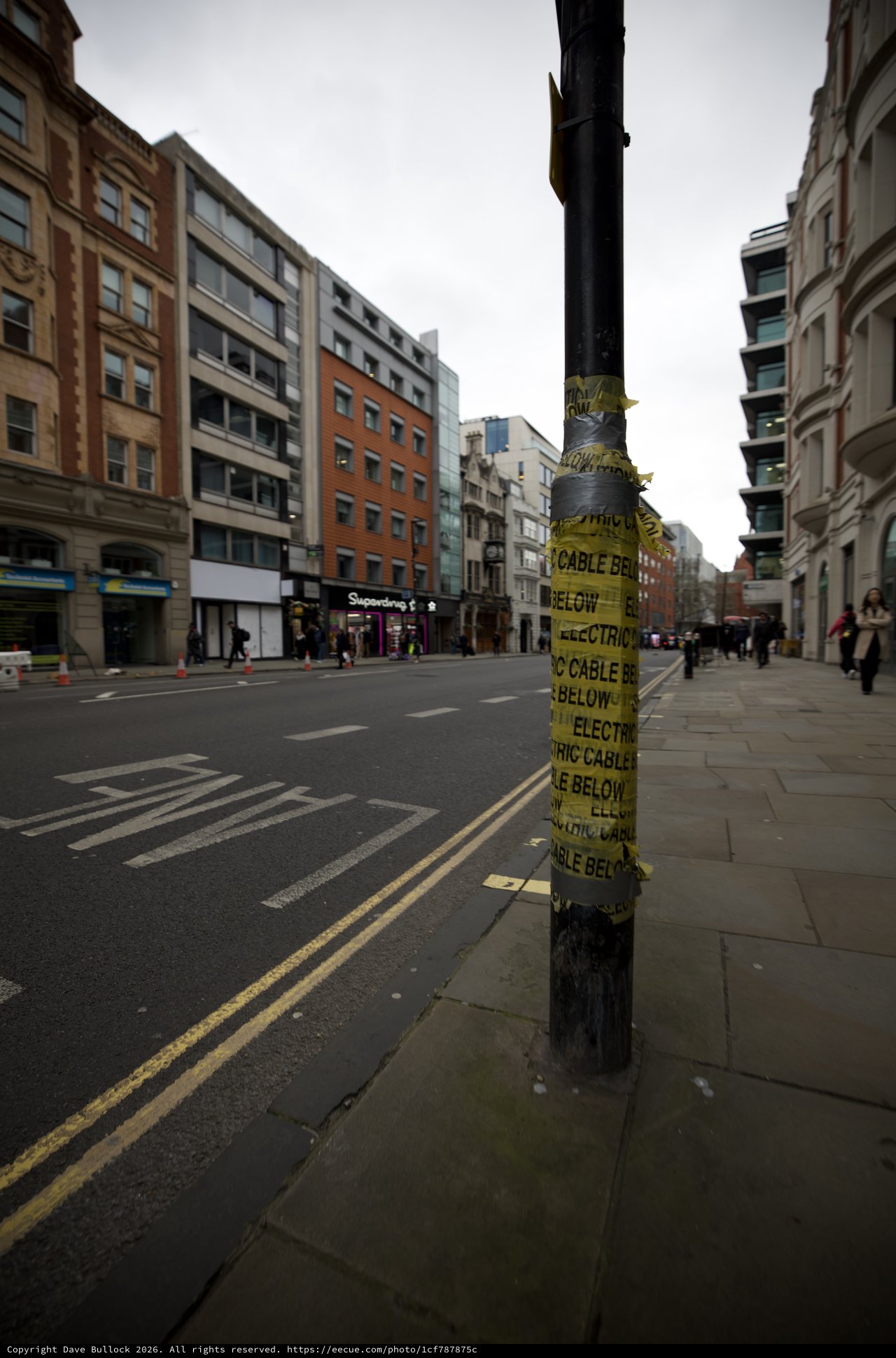 Electric Cable Warning Sign on Urban Street Pole