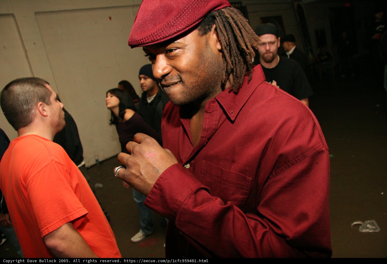 Maroon-Shirted Man in a Crowd