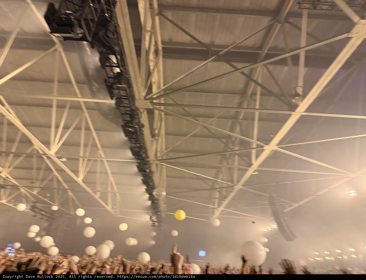 Illuminated Concert Venue Ceiling with Dramatic Lighting