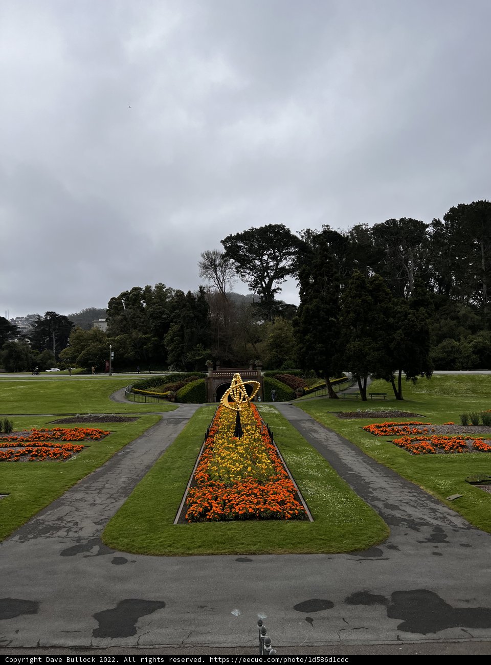The Majestic Flower Bed with a Centerpiece Statue