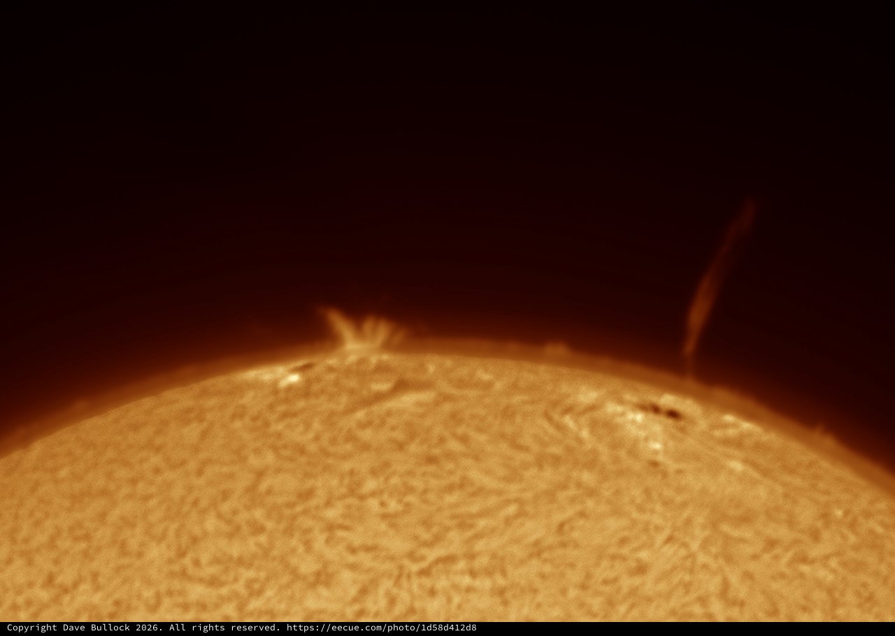 Solar Surge Prominence and Jet Over Sun's Limb