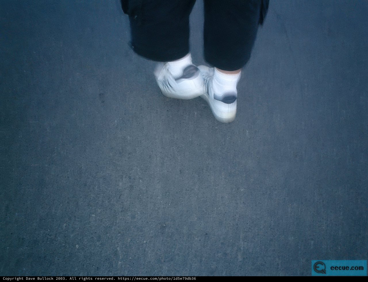 A Walk in Black Pants and White Sneakers