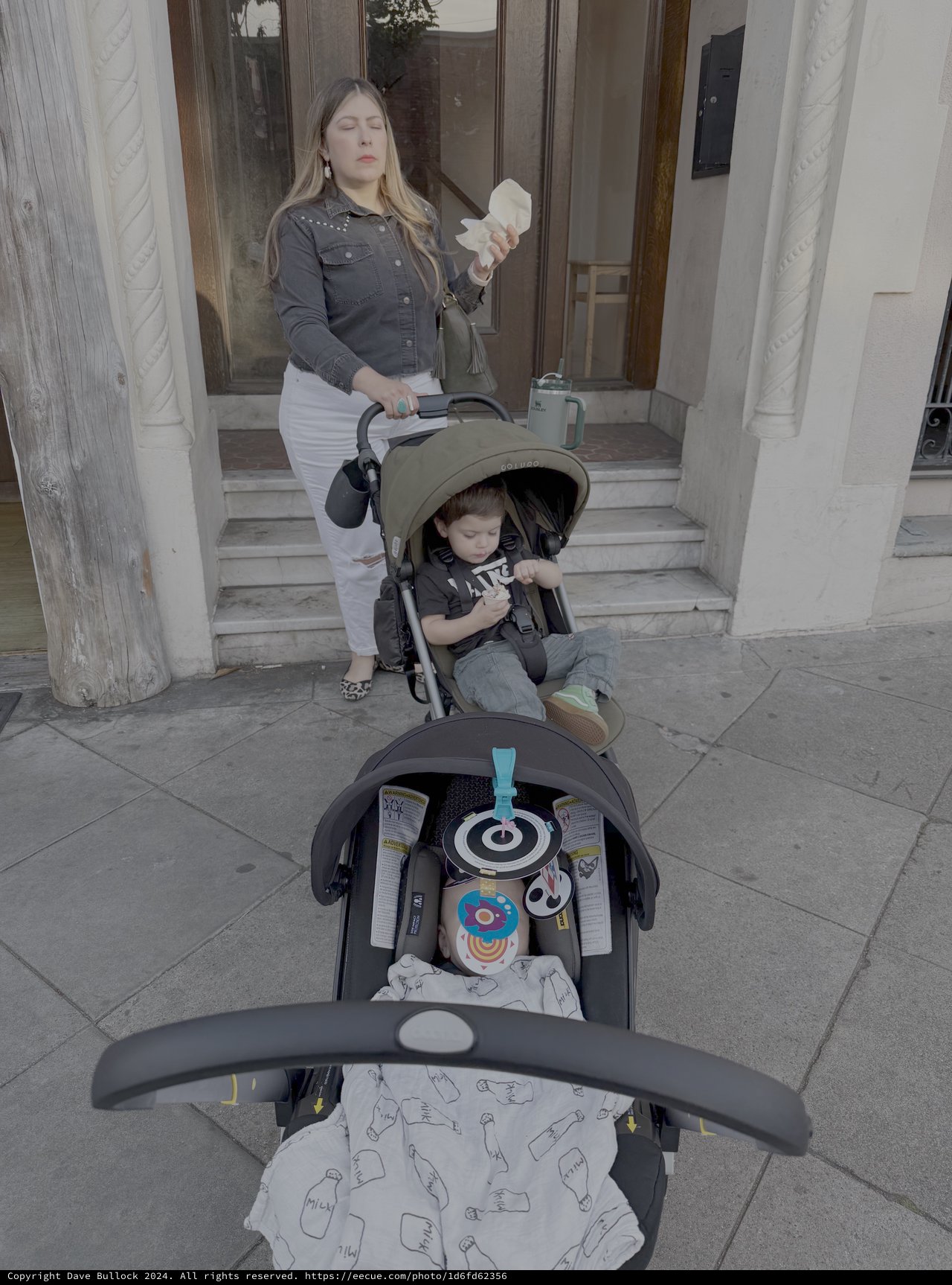 Mother with Baby Stroller on City Steps