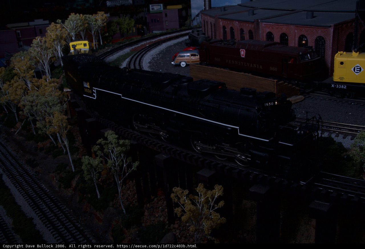 Three Toy Trains on the Railway Track