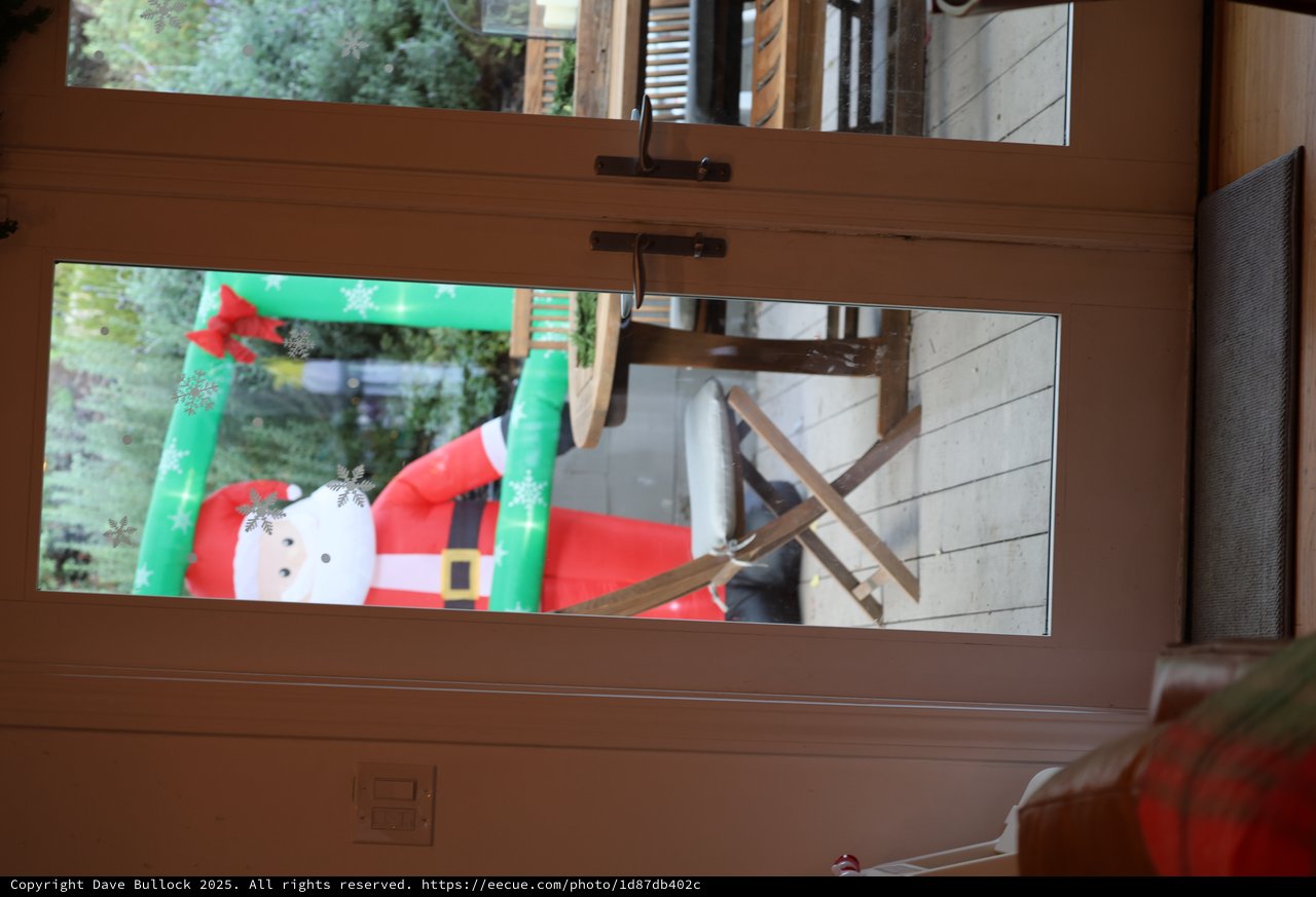 Christmas Snowman Decoration Through Patio Door View