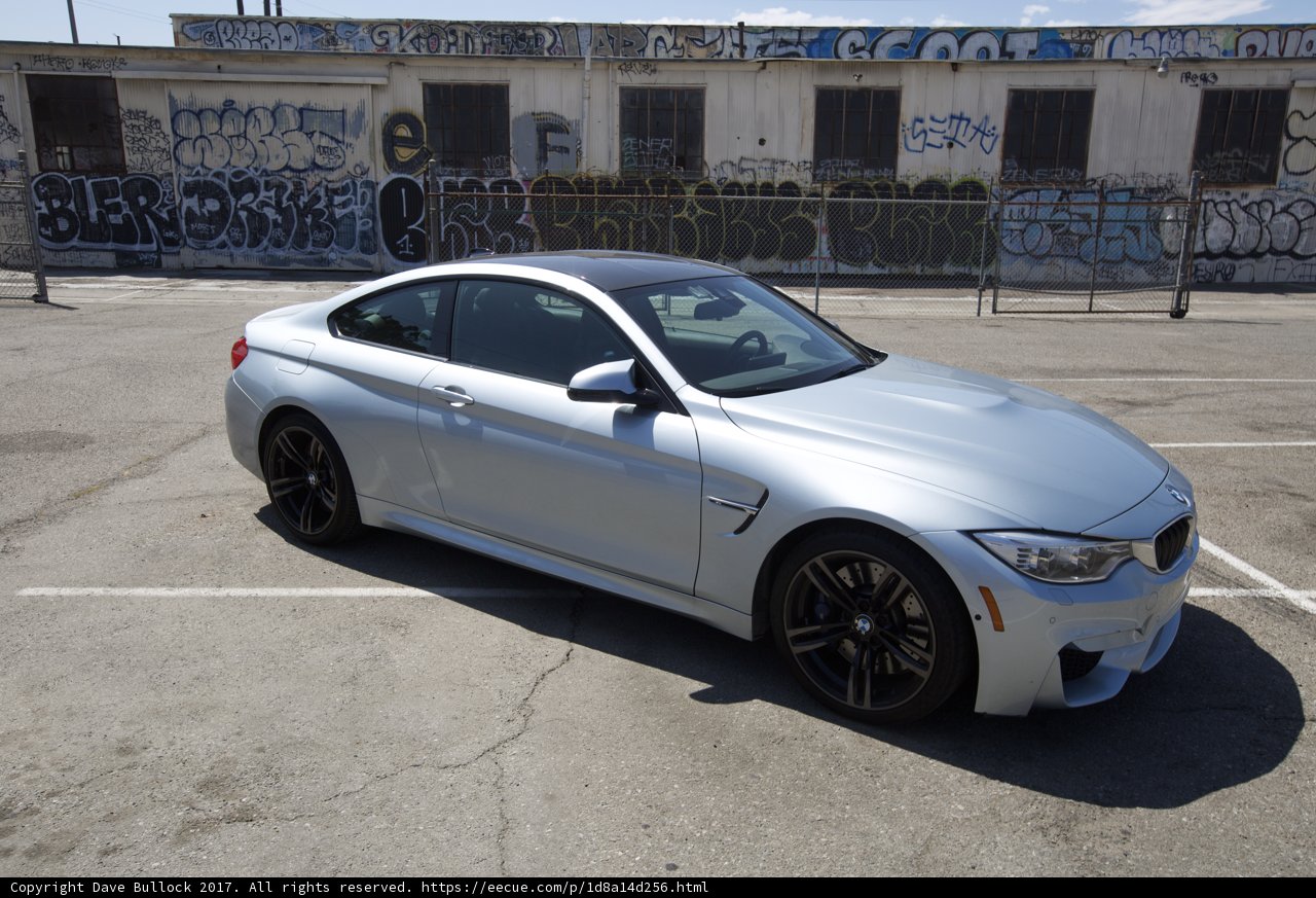 BMW M4 Coupe Parked in Front of Wall