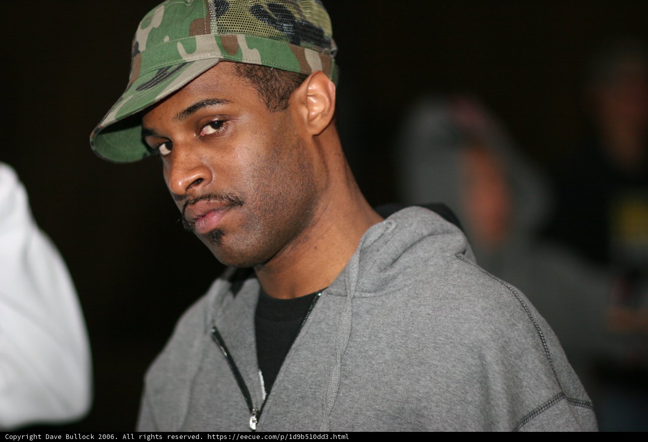 Marcus R in Grey Hoodie with Baseball Cap
