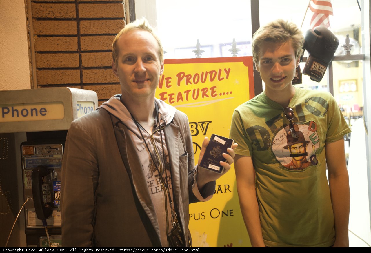 Man with Cell Phone and Friends