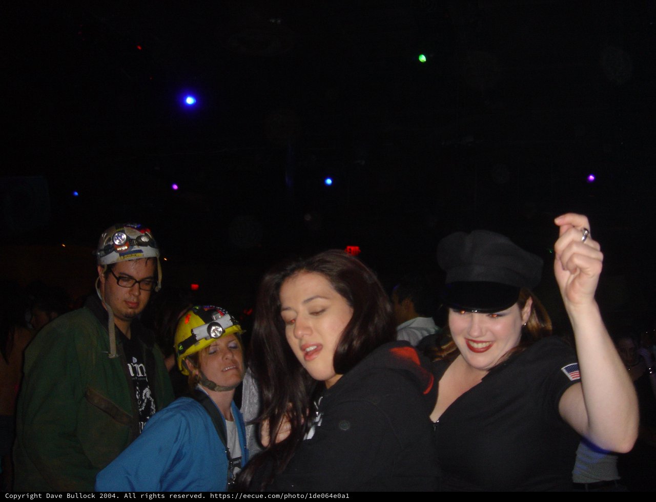 Halloween Party Revelers Dancing in Dark Nightclub