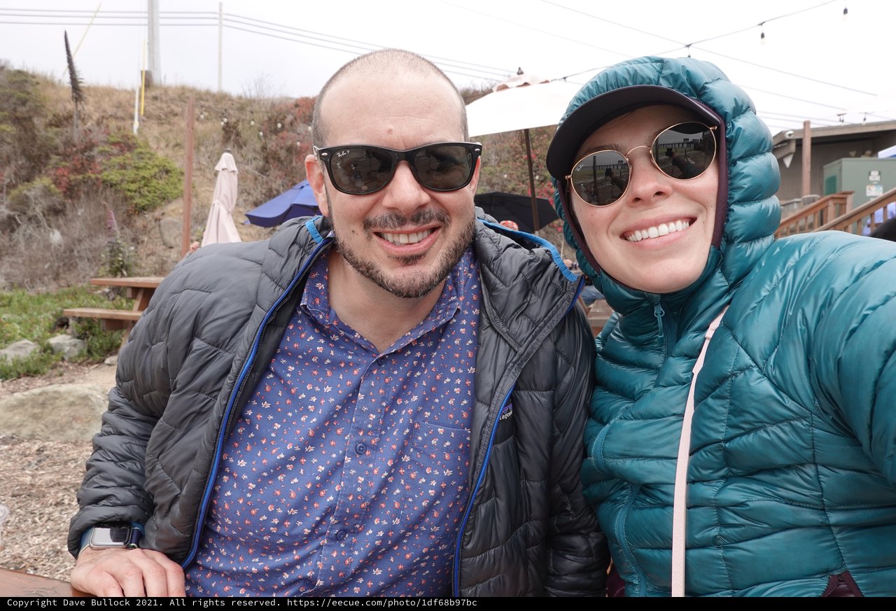 Happy Couple in Winter Jackets Outdoors