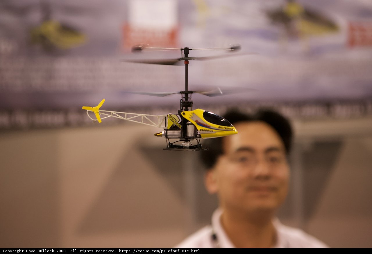 Man in Awe of Toy Helicopter
