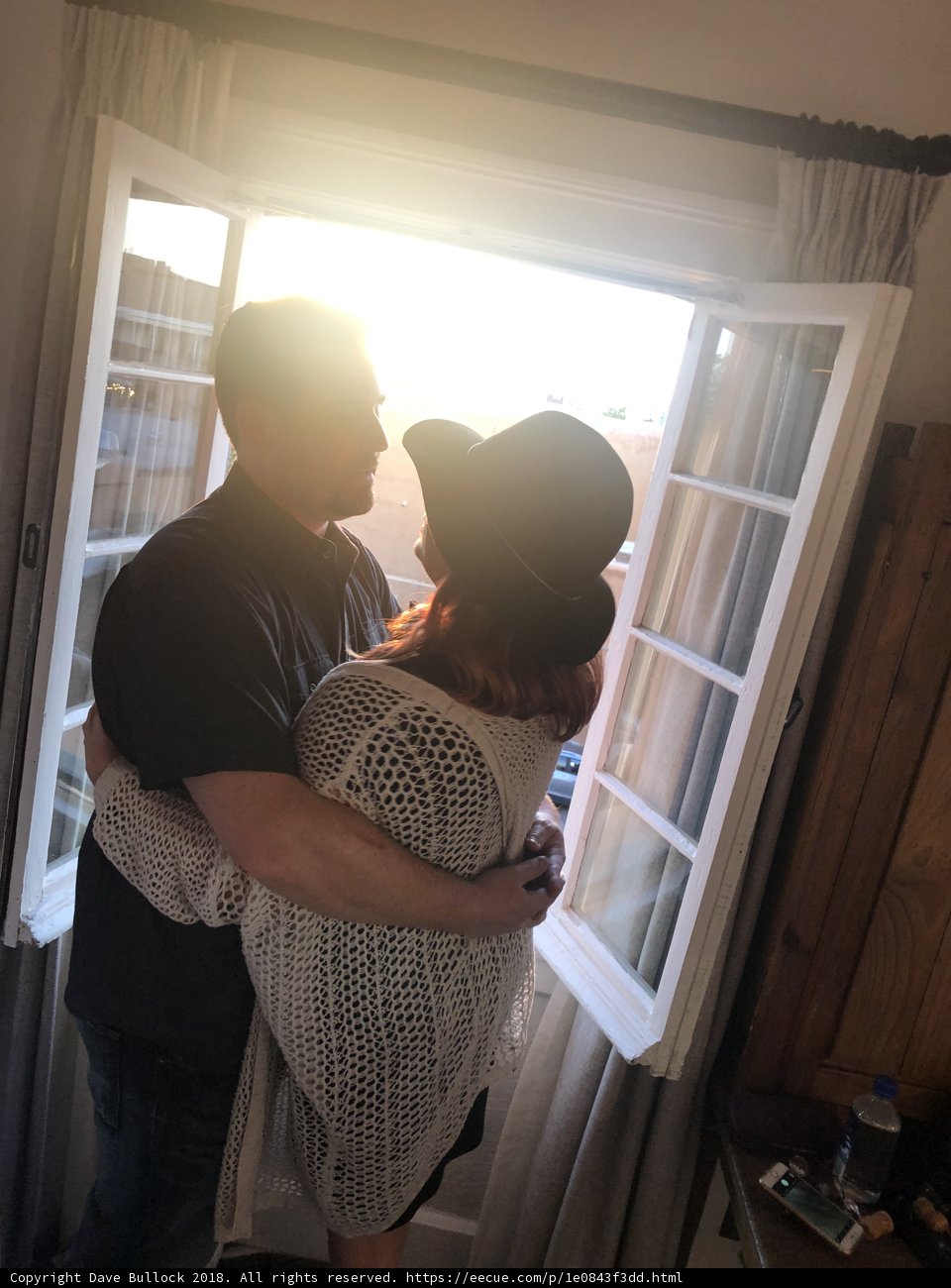 Embracing Love in Front of the Window