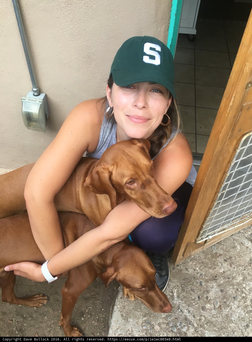 Woman Hugging Her Canine Companions in Santa Fe