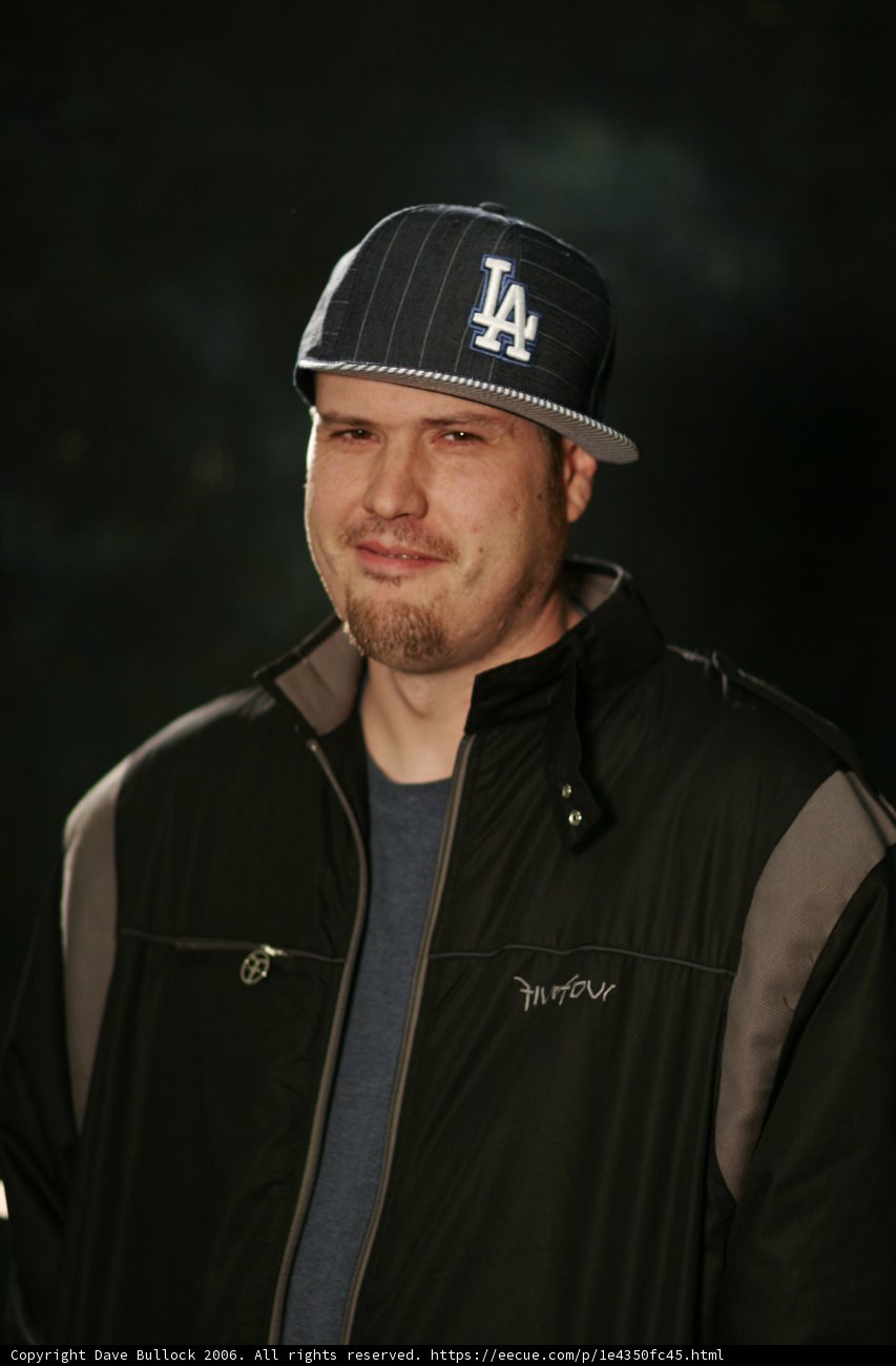 Man in Jacket and Baseball Cap
