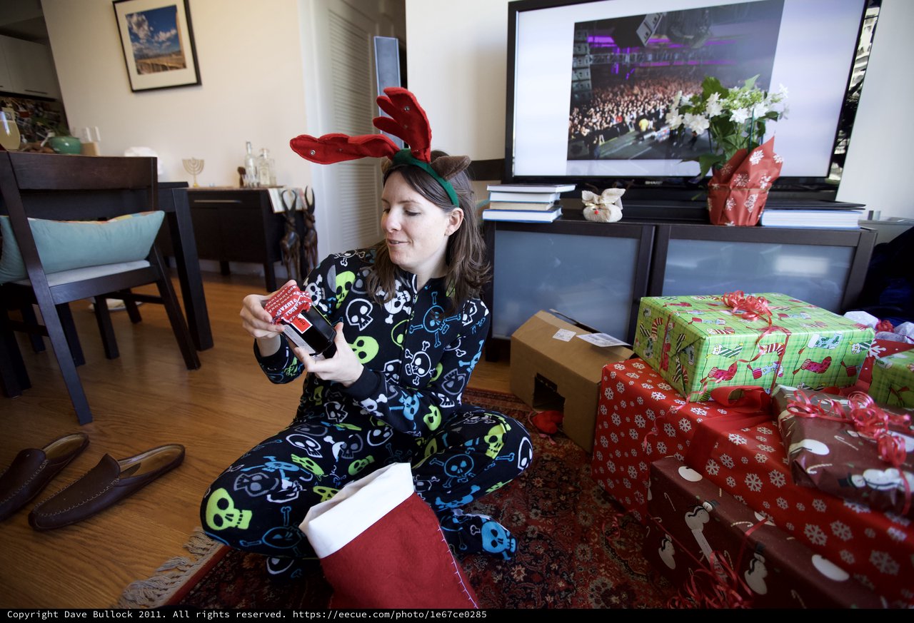 Festive Christmas Morning Gift Opening in Reindeer Pajamas