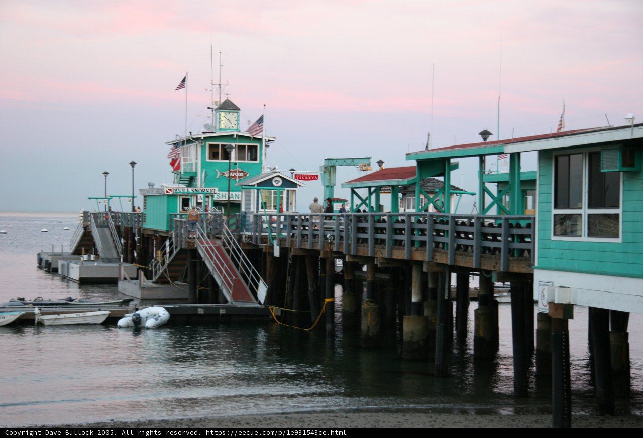 Waterfront Dock with Boats and Flags