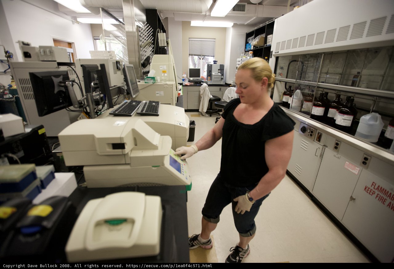 Woman Working on Lab Machine