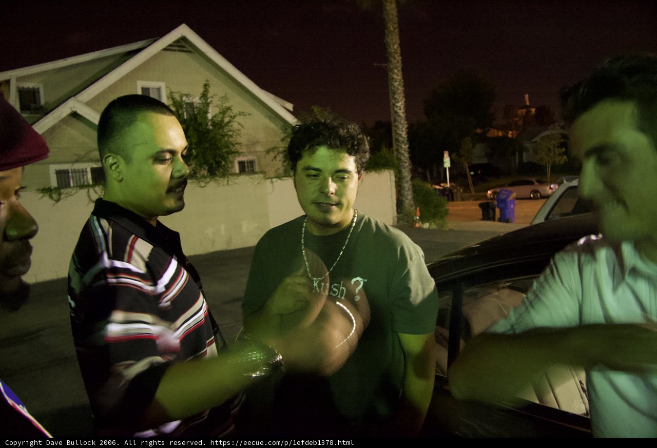 Nighttime Car Scene with Three Men