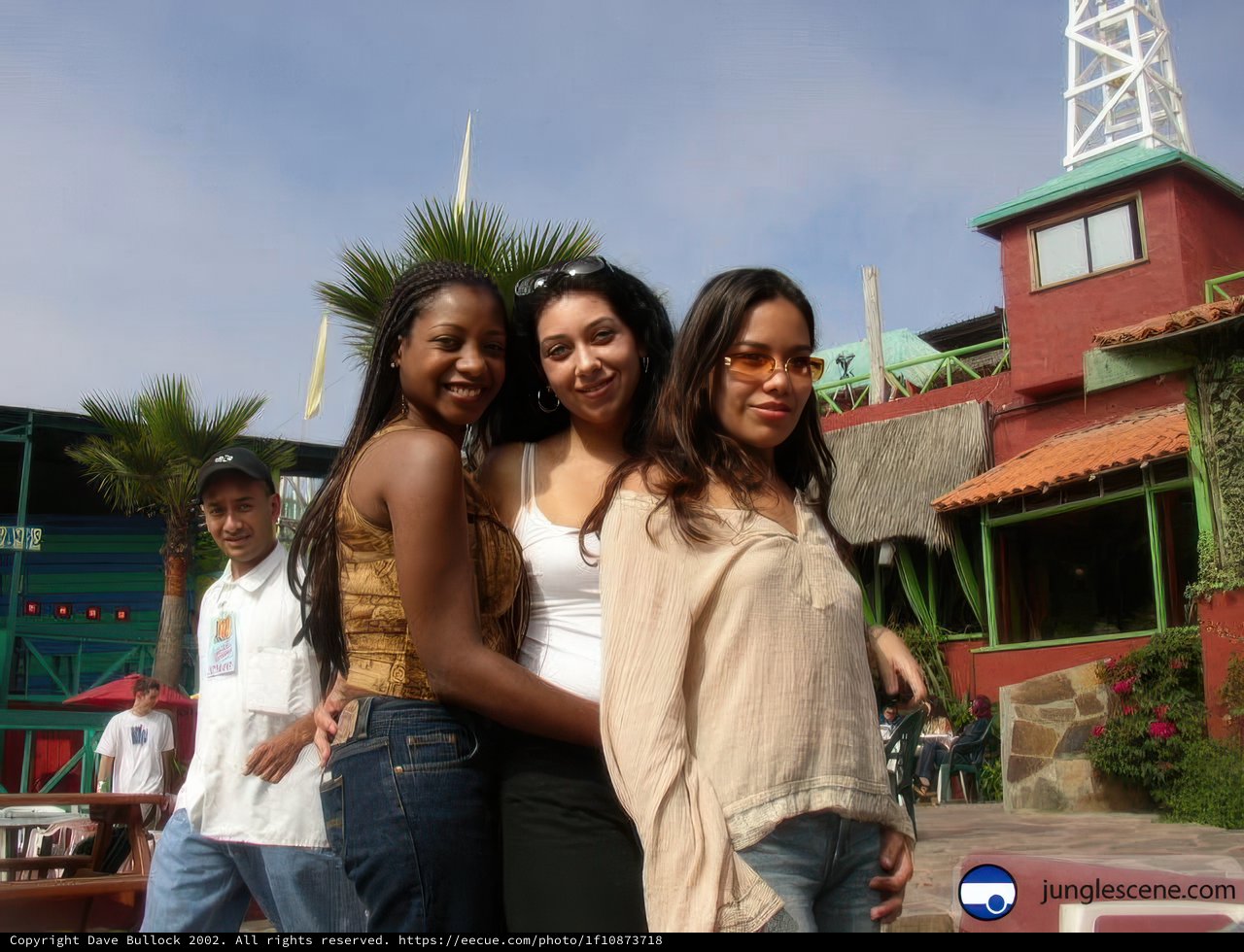 Trio of Friends Strike a Pose in Front of Baseball Stadium