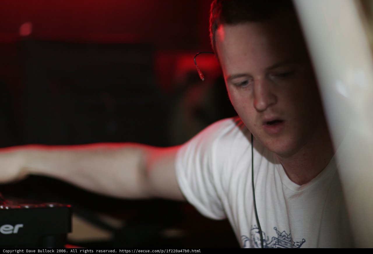 Man Spinning Tunes at Night Club