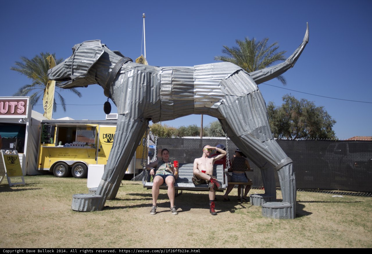 Sitting on Art: A Metal Dog Statue