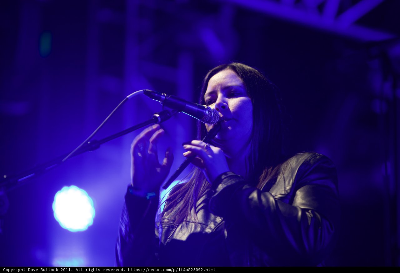 Black-clad Woman Rocks the Stage with Her Voice