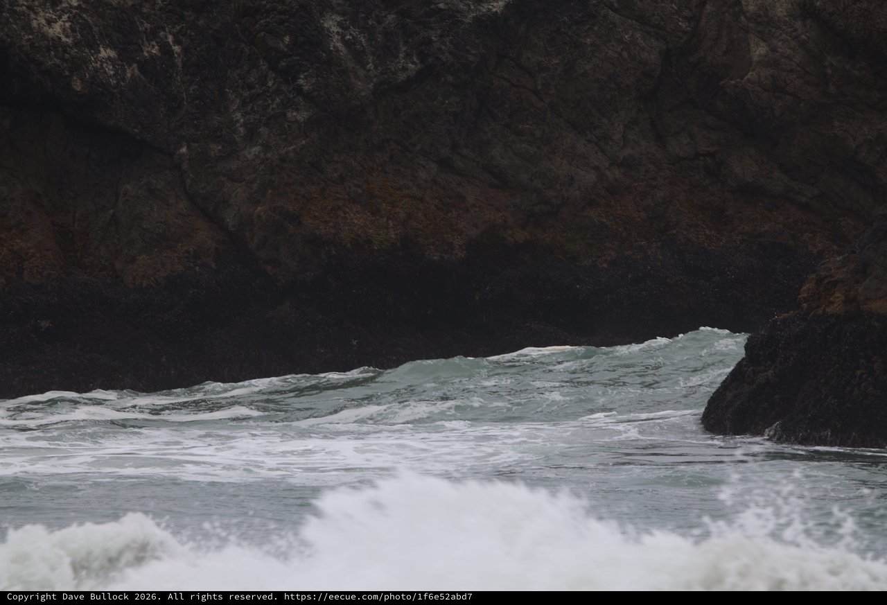 Waves Crashing Through Sea Cave Rocky Cove