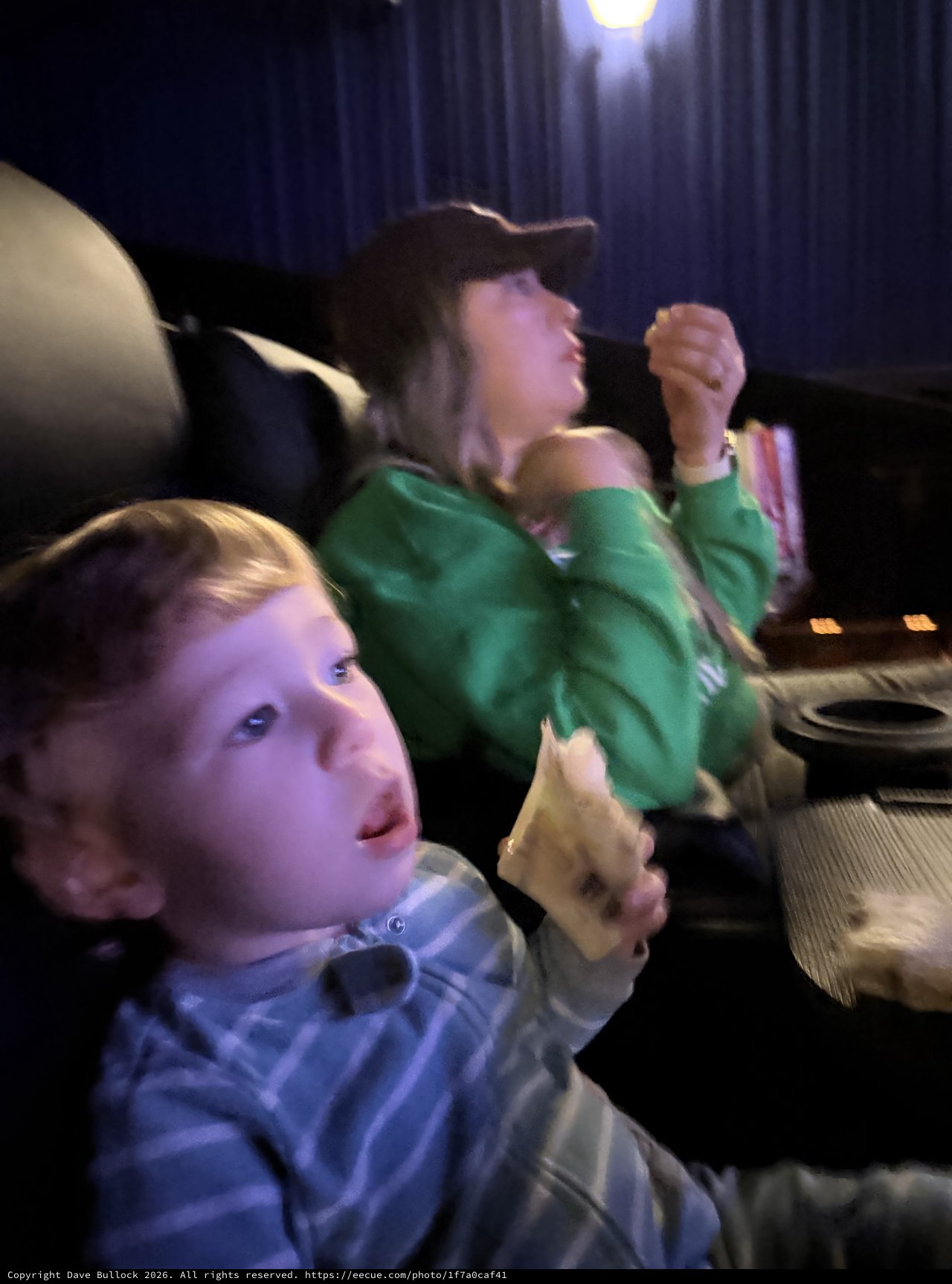 Children Engrossed in Movie Theater Entertainment