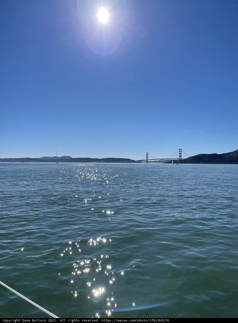 Golden Gate Bridge and Sailboats under a Blue Sky